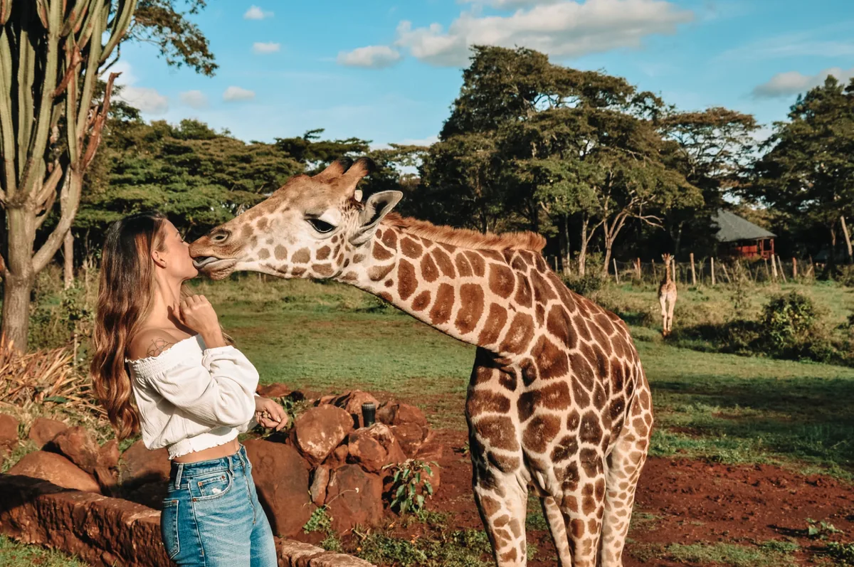 Sarah with a giraffe in Kenya